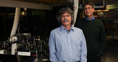 Michael Raymer (left) and Andy Marcus in their lab.